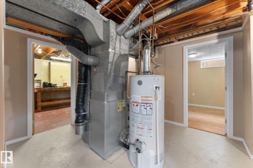 Basement utility area featuring a water heater and HVAC system - 15112 76A Avenue, Edmonton, AB 