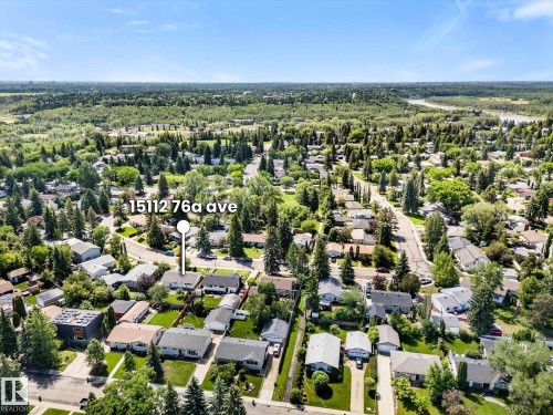 Aerial neighborhood perspective highlighting a residential street and surrounding green spaces - 15112 76A Avenue, Edmonton, AB 