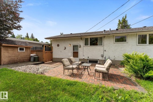 Brick paver patio with direct access to the white stucco exterior - 15112 76A Avenue, Edmonton, AB 