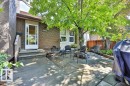 Brick exterior with a white storm door - 17009 109 Street, Edmonton, AB 