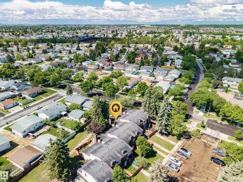 Aerial perspective showcasing a residential neighborhood with a mix of detached homes and townhouses - 17009 109 Street, Edmonton, AB 