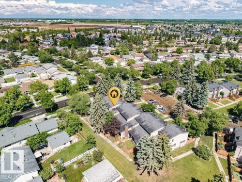 Aerial perspective showcasing a residential area with mature trees and established properties - 17009 109 Street, Edmonton, AB 