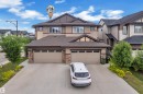 Multi-level residence featuring a brown shingle roof and a beige and brown exterior facade - 7245 Chivers Place, Edmonton, AB 