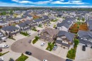 Modern residential street with uniform contemporary homes - 7245 Chivers Place, Edmonton, AB 