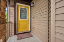 Inviting entry with a bright yellow door featuring decorative glass - 7245 Chivers Place, Edmonton, AB 