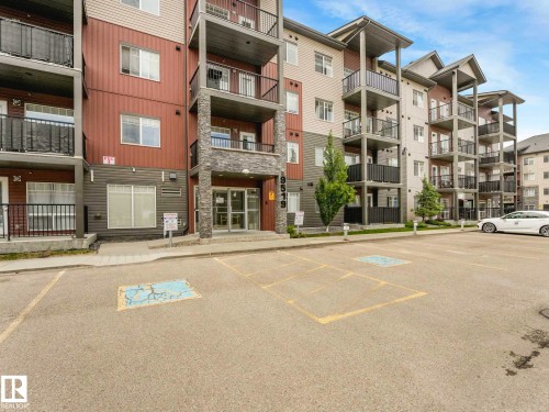 Multi-story residential building featuring a stone and siding exterior - 406 9519 160 Avenue, Edmonton, AB 