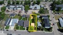 Aerial perspective of a long rectangular property featuring two structures and mature trees - 9209 150 Street, Edmonton, AB 