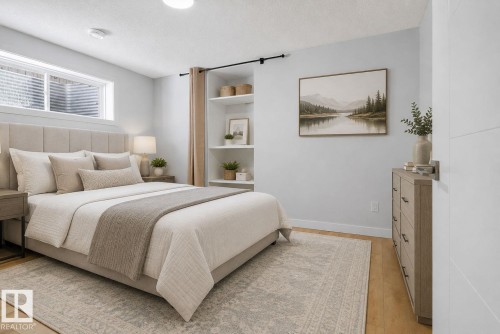 Carpeted bedroom featuring a light wood-finish flooring, a contemporary window with blinds, recessed lighting, and built-in shelving - 5306 67 Street E, Beaumont, AB 