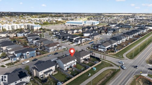 Aerial perspective showcasing a residential development with varied housing styles - 5306 67 Street E, Beaumont, AB 
