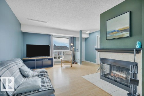 2336 151 Avenue, Edmonton, AB - Indoor Photo Showing Living Room With Fireplace