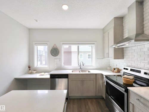 6 11373 12 Avenue, Edmonton, AB - Indoor Photo Showing Kitchen With Double Sink With Upgraded Kitchen