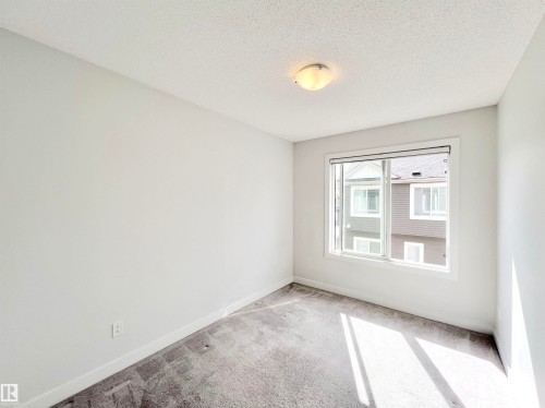 6 11373 12 Avenue, Edmonton, AB - Indoor Photo Showing Other Room