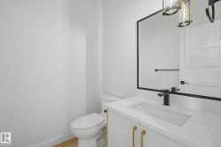 Vanity featuring an integrated rectangular sink, white countertop, and matte black faucet - 
