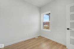 Neutral wall paint with wood-finish flooring - 