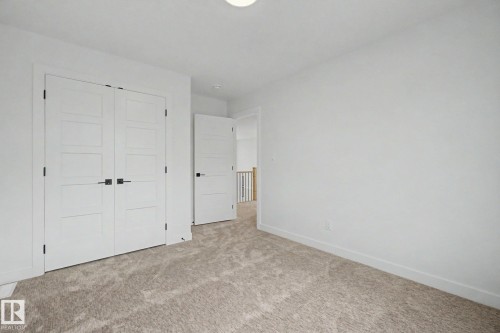Neutral wall finishes paired with plush carpeting - 2 Willow Heights Drive, Stony Plain, AB 