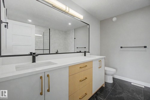 Spacious vanity with dual integrated sinks and matte black fixtures - 2 Willow Heights Drive, Stony Plain, AB 