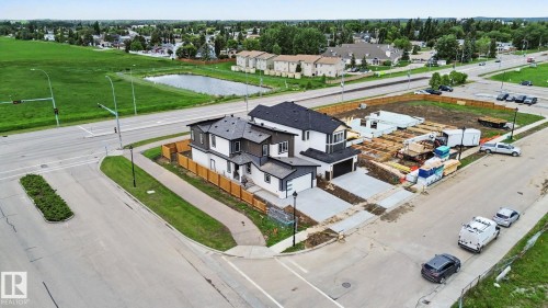 Contemporary duplex with two-story design and attached garages - 2 Willow Heights Drive, Stony Plain, AB 