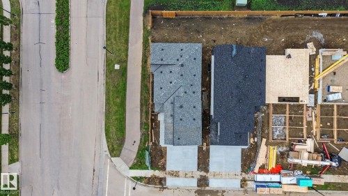 New construction property featuring a grey shingle roof and a concrete driveway - 2 Willow Heights Drive, Stony Plain, AB 