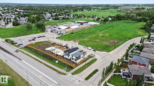 Corner lot featuring new construction residences, direct road frontage, established residential surroundings, and green space - 2 Willow Heights Drive, Stony Plain, AB 