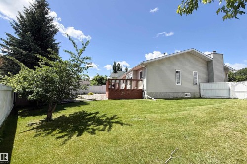 Expansive green lawn with a large wooden deck - 5607 188A Street, Edmonton, AB 