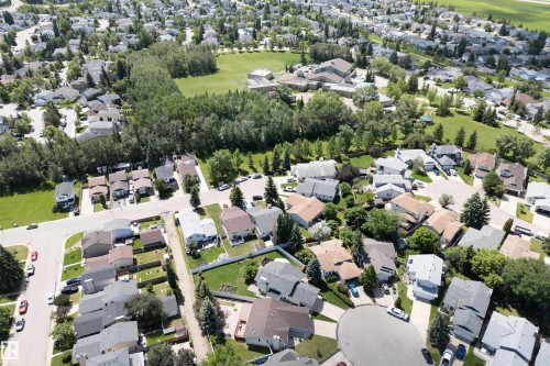 Residential neighborhood featuring mature trees, paved streets, and a variety of detached homes - 5607 188A Street, Edmonton, AB 