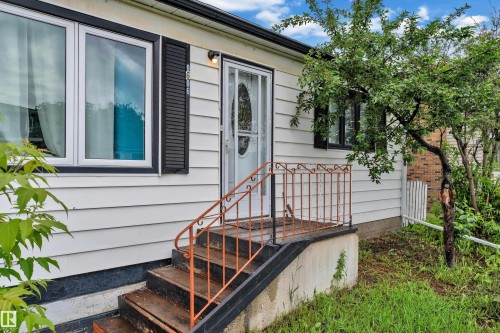 White siding exterior featuring black shutters and trim - 9606 161 Street, Edmonton, AB 