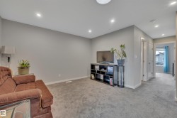 Carpeted room with light grey wall paint and recessed ceiling lights - 