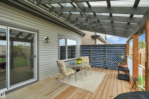 Expansive wood deck with a translucent pergola covering - 157 Larch Crescent, Leduc, AB 