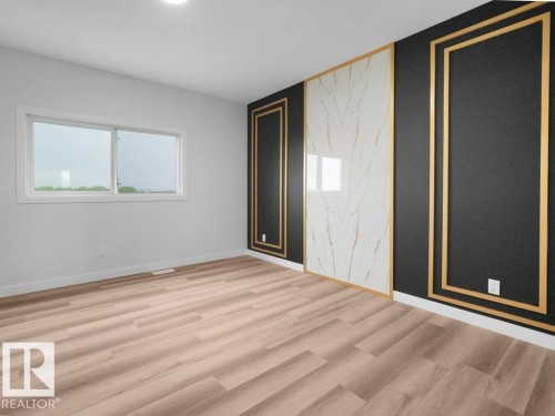 Accent wall featuring black and white panels with gold trim - 18719 130 Street, Edmonton, AB 
