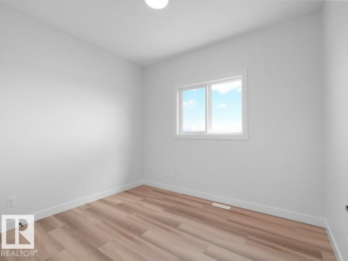Neutral-toned walls complement wood-finish flooring - 18723 130 Street, Edmonton, AB 