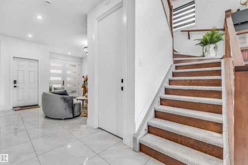 Hardwood staircase with carpeted treads - 208 33 Street, Edmonton, AB 