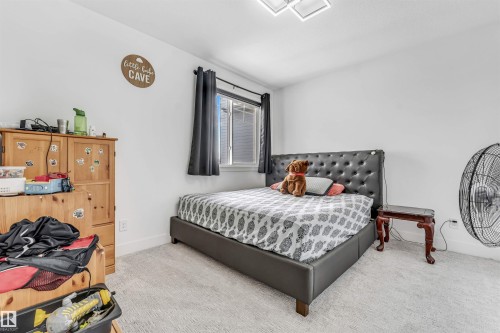 Bedroom featuring light-colored carpet flooring and white walls - 208 33 Street, Edmonton, AB 