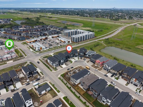 Aerial perspective showcasing a modern residential neighborhood with varied architectural styles - 208 33 Street, Edmonton, AB 