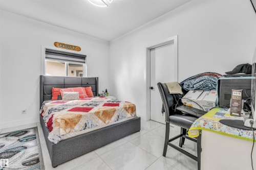 White interior walls with a single window featuring horizontal blinds - 208 33 Street, Edmonton, AB 
