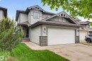 Contemporary two-story residence featuring light gray siding and dark gray trim accents - 74 Santana Crescent, Fort Saskatchewan, AB 