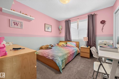 Room featuring a window with horizontal blinds, overhead lighting fixture, and carpet flooring - 74 Santana Crescent, Fort Saskatchewan, AB 