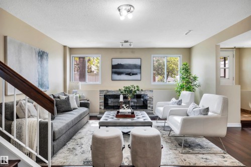 10909 33A Avenue, Edmonton, AB - Indoor Photo Showing Living Room With Fireplace