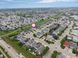 Aerial perspective of a residential neighborhood with varied architectural styles - 