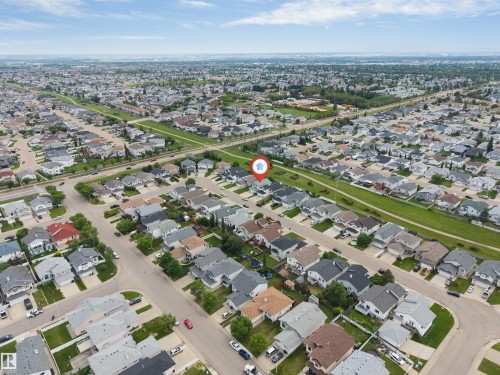 Aerial perspective showcasing a residential neighborhood with varied home styles - 6719 164 Ave, Edmonton, AB 