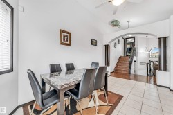 Dining area with tile flooring and a window with horizontal blinds - 
