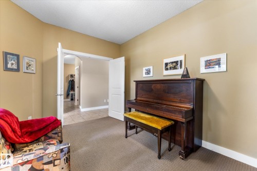 Carpeted room featuring neutral wall tones - 488 Macewan Road, Edmonton, AB 
