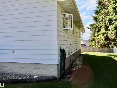 White horizontal siding on exterior - 5530 46 Street, Barrhead, AB 