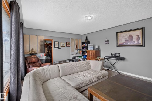 Interior space featuring neutral gray walls and a textured white ceiling - 9315 132A Avenue, Edmonton, AB 