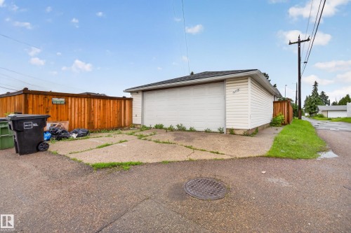 Detached garage with white siding and a dark shingle roof - 9315 132A Avenue, Edmonton, AB 