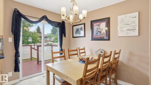 Dining area featuring light-toned flooring and neutral wall tones - 1827 36 Street Nw, Edmonton, AB 
