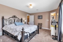 Carpeted room with neutral-toned walls, a white ceiling, and a flush-mount ceiling light - 