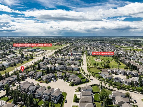 Aerial perspective showcasing a residential area with varied housing styles - 18 Voleta Crest, Spruce Grove, AB 