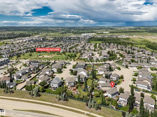 Aerial perspective showcasing a residential neighborhood with a variety of detached homes - 18 Voleta Crest, Spruce Grove, AB 