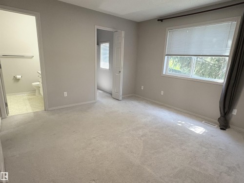 Master Bedroom with 3pc ensuite and a large walk in closet with window - 21354 87A Avenue, Edmonton, AB 