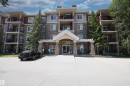 View of apartment building / complex featuring uncovered parking - 311 2098 Blackmud Creek Drive, Edmonton, AB 
